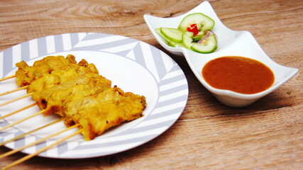 Pork satay,Grilled pork served with peanut sauce or sweet and sour sauce, Thai Street food.