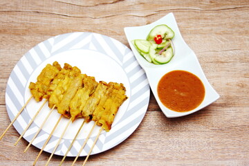 Pork satay,Grilled pork served with peanut sauce or sweet and sour sauce, Thai Street food.