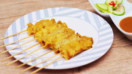 Pork satay,Grilled pork served with peanut sauce or sweet and sour sauce, Thai Street food.