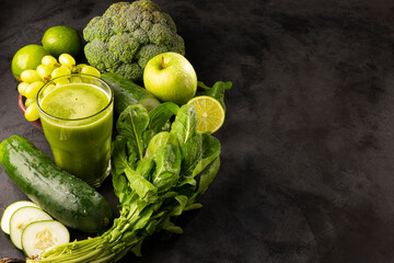 Healthy detox smoothie with cucumber, broccoli, green apple, kale and green grapes. Detox drink.