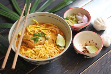 Khao Soi Recipe,Khao Soi,Khao Soi Kai, Thai Noodles Khao Soi, Chicken Curry with seasoning served on wooden table