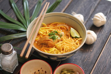 Khao Soi Recipe,Khao Soi,Khao Soi Kai, Thai Noodles Khao Soi, Chicken Curry with seasoning served on wooden table