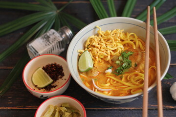 Khao Soi Recipe,Khao Soi,Khao Soi Kai, Thai Noodles Khao Soi, Chicken Curry with seasoning served on wooden table