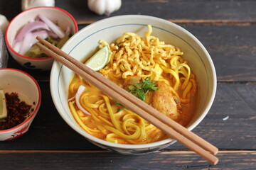 Khao Soi Recipe,Khao Soi,Khao Soi Kai, Thai Noodles Khao Soi, Chicken Curry with seasoning served on wooden table