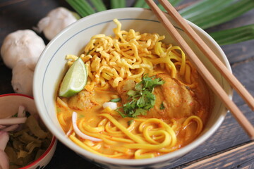 Khao Soi Recipe,Khao Soi,Khao Soi Kai, Thai Noodles Khao Soi, Chicken Curry with seasoning served on wooden table
