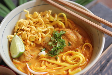Khao Soi Recipe,Khao Soi,Khao Soi Kai, Thai Noodles Khao Soi, Chicken Curry with seasoning served on wooden table