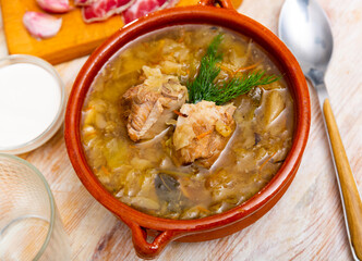 National dish of Russian cuisine is cabbage soup, cooked in thick broth and on the basis of sauerkraut with meat