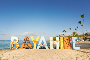 Bayahibe inscription word on Dominicus beach, copy space - obrazy, fototapety, plakaty