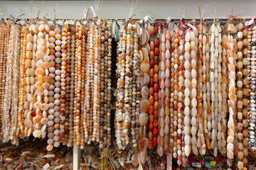 Variety of natural stone beads to make necklaces and bracelets in jewelry store