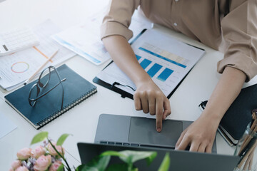 Close up  woman using laptop, typing on keyboard, writing message or email, pensive businessman or...
