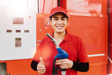 Portrait of working with friendship handsome Asian male employee wearing a red uniform stands to...