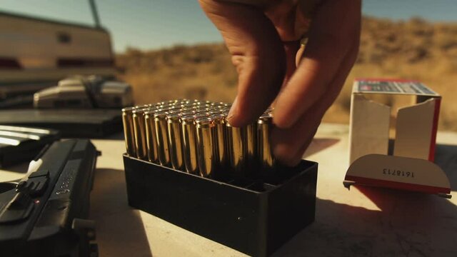 Close up view of bullets been loaded on in a gun before shooting in Pleasant Valley in Bishop California,USA on 4th of July.