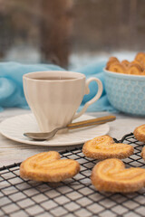 Cup of coffee and cookies for breakfast. 