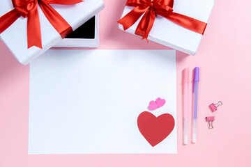 Empty white paper with heart and gift box with a colored background
