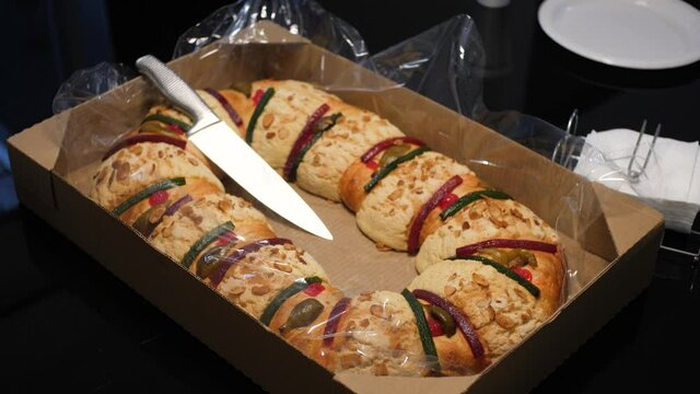 Slow Motion Framing Of Traditional Mexican Rosca de Reyes Bread, Special Bread With Fruit And Sugar With The Shape Of A Crown. Family Celebration Due To Three Kings Day In Mexican Family Home