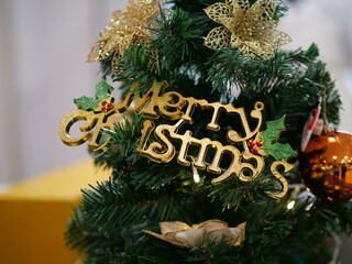 Close up view for the decorations on the Christmas Tree branch b-roll footage. Light flickering on the glowing balls flowers and bowknots on the pine tree leaves festival celebration and X-mas concept