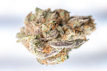 Macro view of marijuana bud, top down.  Cannabis crystals and trichomes visible on close up shot of medical marijuana ready to be prepared for use.