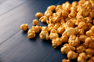 Heap of Caramel Corn Background on blue rustic table
