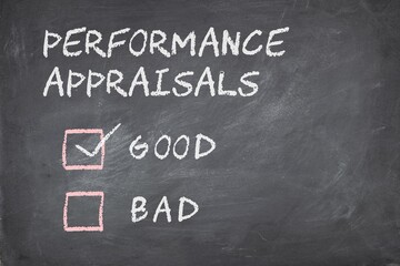 Obraz premium Performance appraisals good or bad check boxes on blackboard background. 