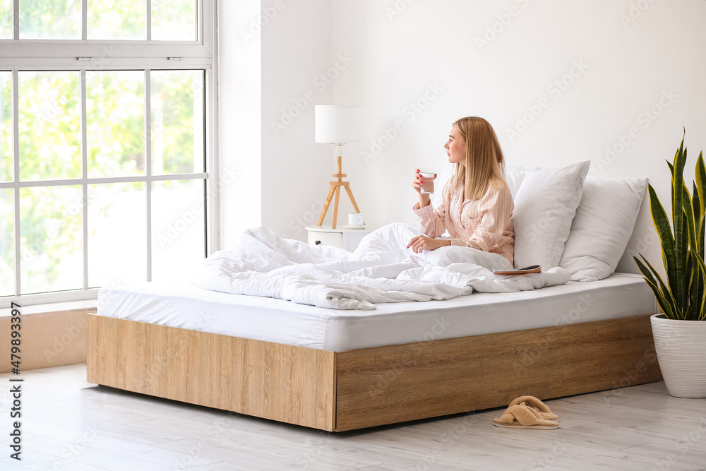 Canvas Prints morning of beautiful woman with glass of water in bed