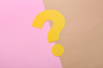 Question mark made of yellow paper on color background