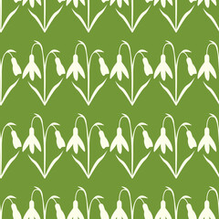 White snowdrops on green seamless pattern