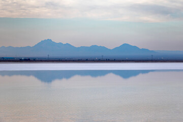 Sunset and azure mountains on the salt lake