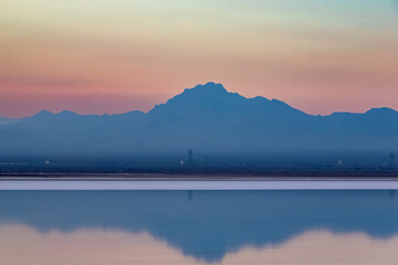 Sunset and azure mountains on the salt lake