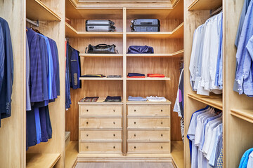 Stylish walk in closet with furniture of maple solid and veneer wood for clothes storage with crown...