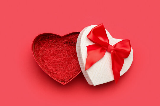 Gift box for Valentine's Day on red background