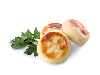 Tasty cottage cheese pancakes and parsley on white background