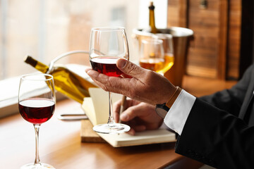 Mature sommelier tasting types of wine