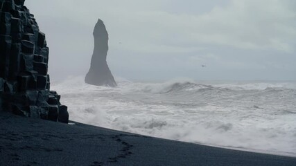 Extremely Dangerous Sneaker Waves At The Reynisfjara Black Sand Beach In Iceland With Basalt Sea Stack In Foggy Background. wide - Powered by Adobe