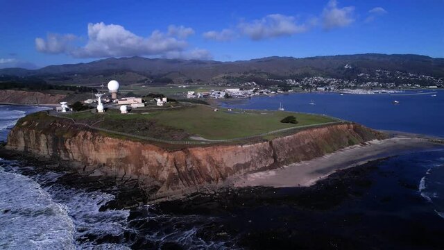 Drone push in of Pillar Point Air Force Station, Mavericks Beach, and Half Moon Bay.  Granada, CA.  23.976 FPS.