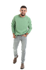Fototapeta premium Handsome young man in warm sweater on white background