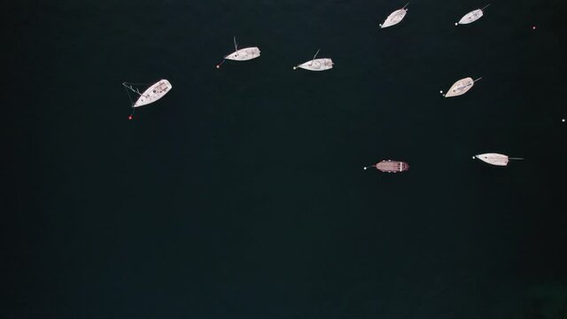 4K drone view of boats in the lake of Garda