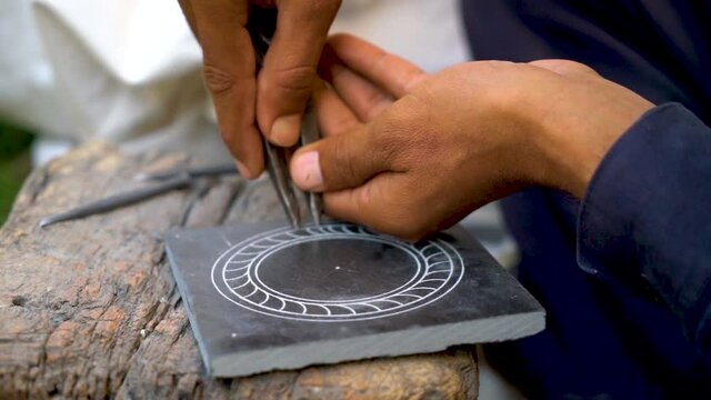  Slow-motion shot of Pakistani marble art on rocks