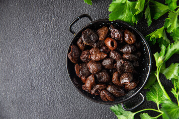 olive pitted dried smoked olives healthy meal food snack on the table copy space food background
