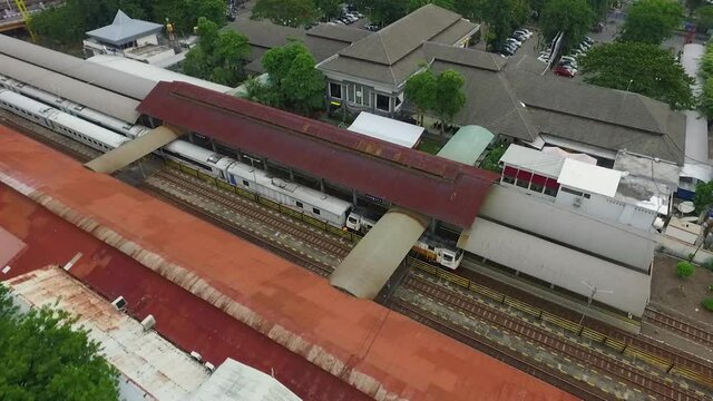 Aerial drone shot of train station and railroads in Surabaya, Indonesia
