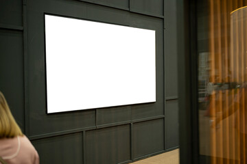 Fototapeta premium Large blank billboard on a street wall, banners with room to add