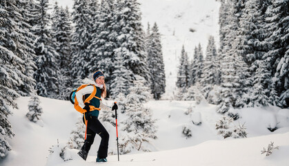 Mountaineer backcountry ski walking ski alpinist in the mountains. Ski touring in alpine landscape...