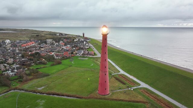 Lighthouse tower Lange Jaap in Den Helder drone aerial footage 5K along the sea near the island of Texel in North Holland, The Netherlands.