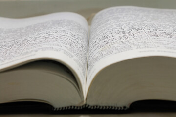 the book is an old thick stack of the bible