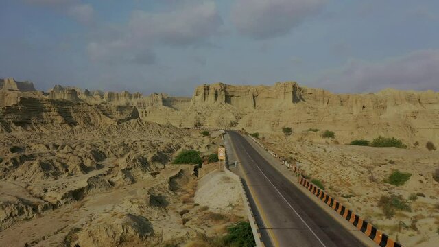 Aerial Over Empty Highway Road Through Rugged Hingol National Park In Balochistan Desert Landscape. Tracking Shot