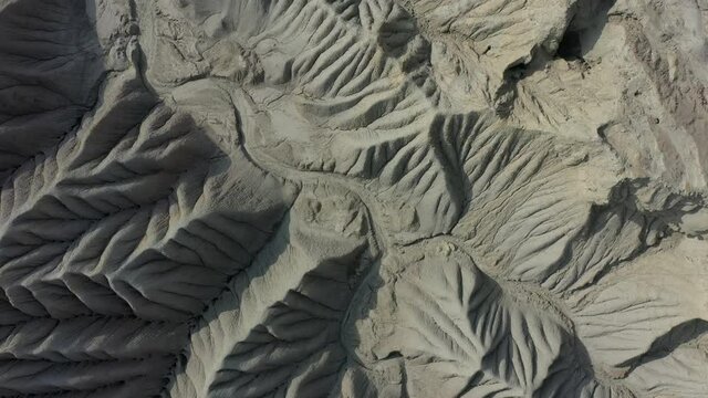 Aerial Looking Down At Weathered Geological Rock Formations With Dry River Bed At Balochistan. Pedestal Down