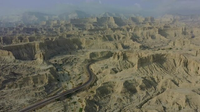 Aerial View Of Epic Arid Mountain Landscape Of Balochistan With Road Going Through. Circle Dolly