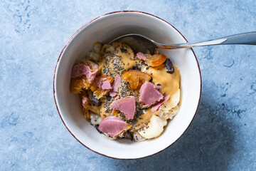Porridge with Ruby Chocolate, Candied Orange Slices and Chia Seeds.