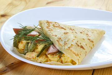 Pancake with potato and sausages