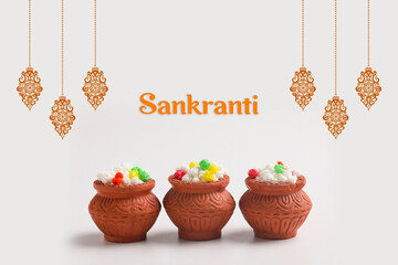Indian festival makar sankranti concept : Tilgul in small bowl. Tilgul is a colourful sesame candy...