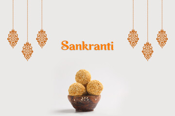 Indian festival makar sankranti concept : Tilgul in small bowl. Tilgul is a colourful sesame candy coated with sesame seeds; in Maharashtra people exchange tilgul on Sankranti